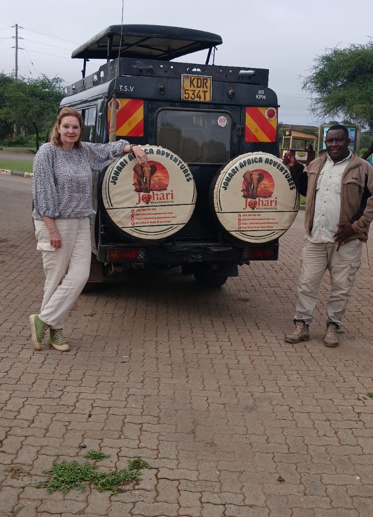 Johari Africa Adventures guest with our guide - book the best Kenya luxury safari tour packages from Nairobi, Diani, Mombasa, Malindi and Watamu - www.johariafricaadventures.com
