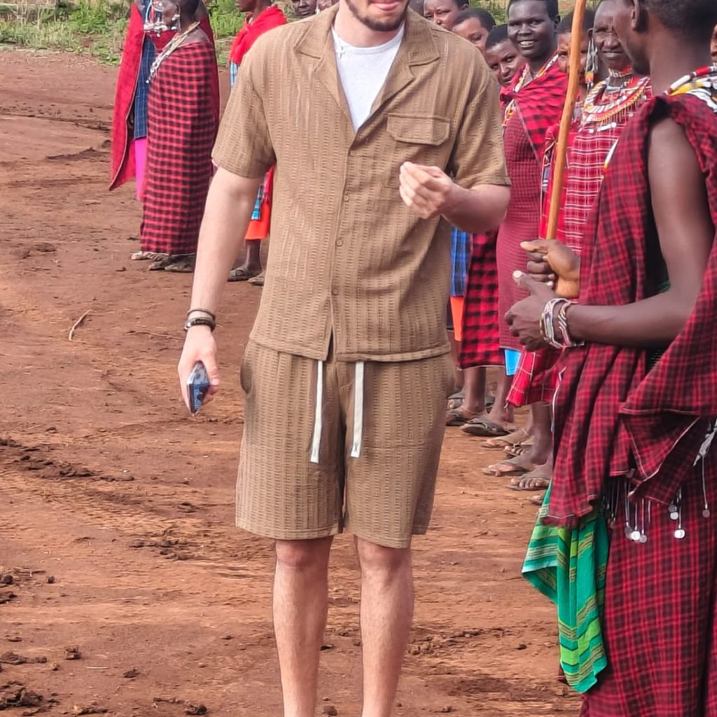 Johari Africa Adventures guests enjoying an immersive cultural experience with the Maasai book the best Kenya luxury safari tour packages from Nairobi Diani Mombasa Malindi and Watamu
