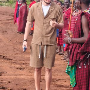 Johari Africa Adventures guests enjoying an immersive cultural experience with the Maasai book the best Kenya luxury safari tour packages from Nairobi Diani Mombasa Malindi and Watamu